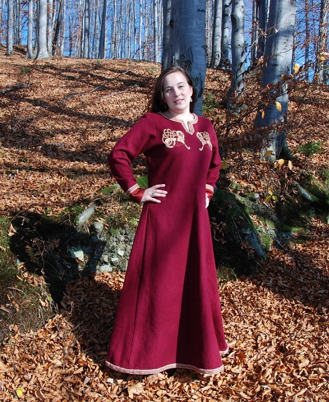 Red woolen dress decorated with embroidery